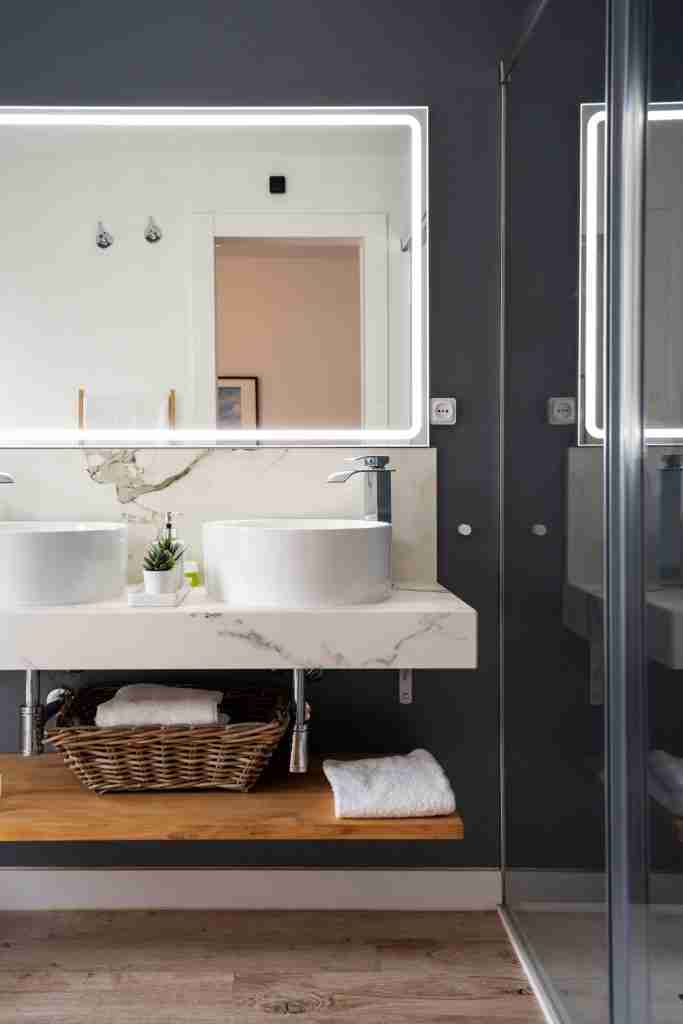 Interior of light modern bathroom with a mirror with light Condo Bathroom Renovations in Toronto - 7