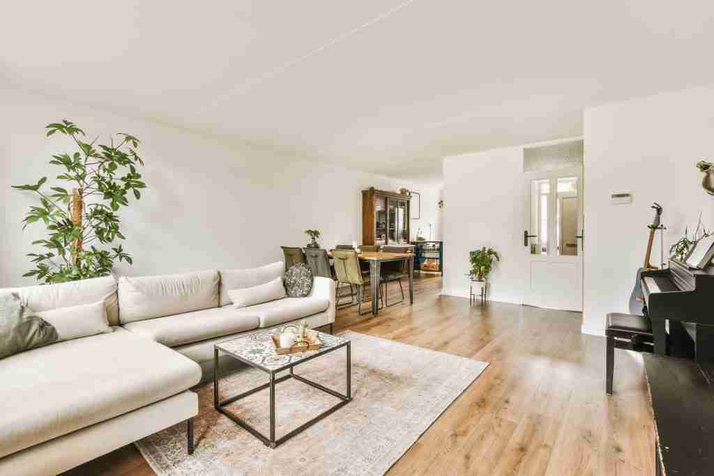 a living room with a couch and a coffee table CondoLift